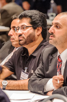 close-up of two participants listening to a speaker