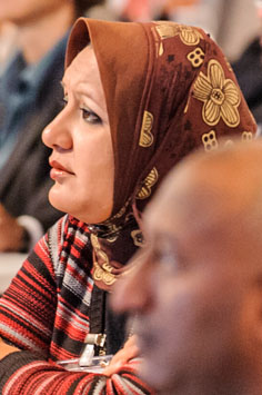 Close-up of a participant listening to a speaker
