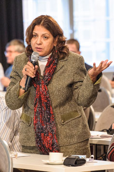 Listener standing with a microphone in her hand