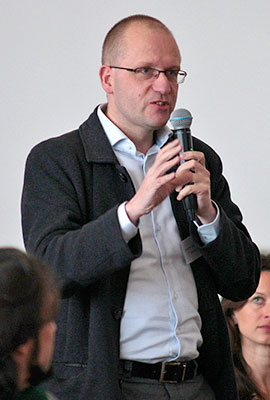 Listener standing with a microphone in his hand