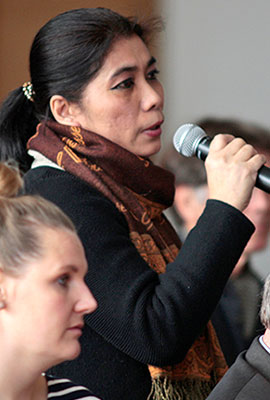 Listener standing with a microphone in her hand