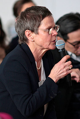 Listener standing with a microphone in her hand