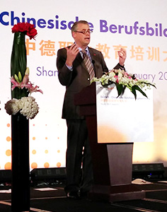 Man speaks from the podium
