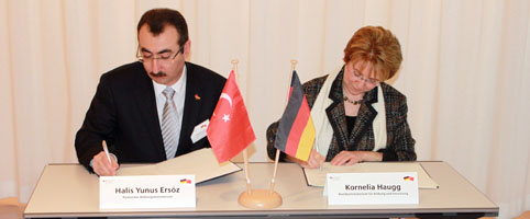 two persons sign a declaration of intent