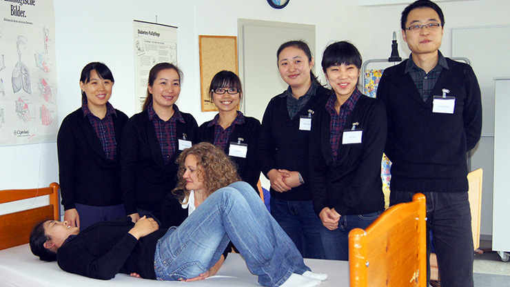 Chinese trainees receiving training in elderly care