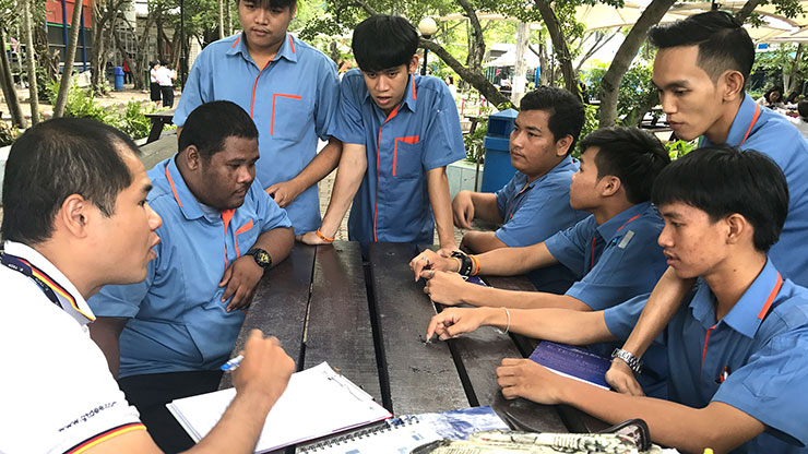 Thai men sitting at a table