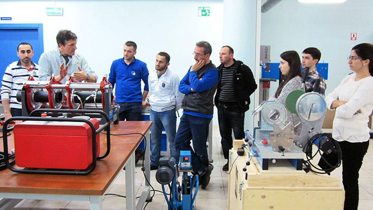 group of people visiting a training workshop